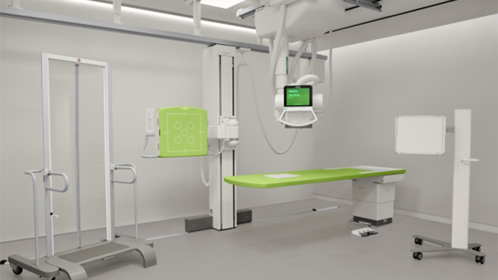 Technologist using smart AI enabled device to review precise positioning results of an X ray exam